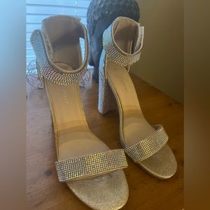 Size 6.5 iridescent rhinestone heels. Left shoe strap is missing d some jewels.